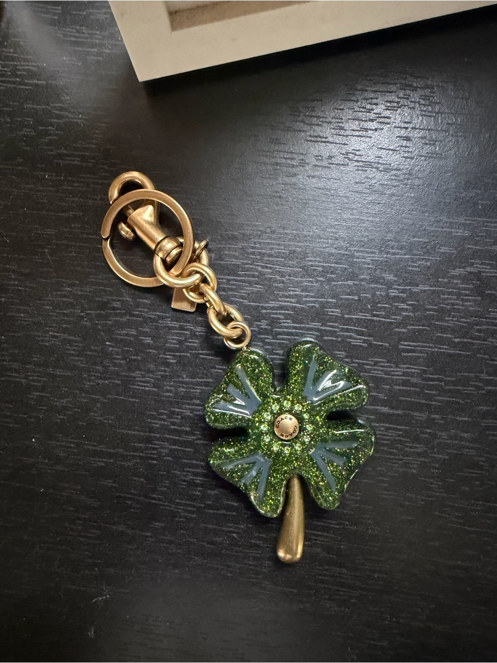 COACH Shamrock glitter bag charm